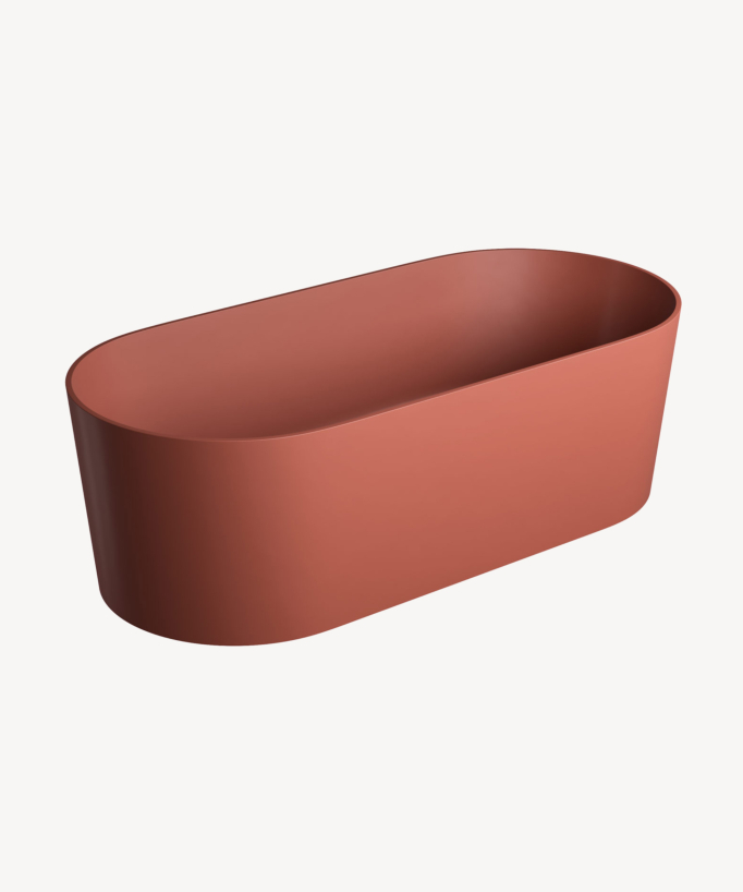 Baignoire îlot couleur terracotta avec une forme ovale très minimaliste 